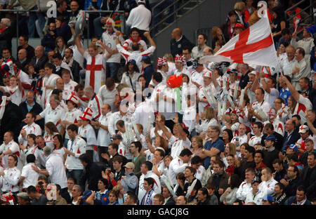 England supporters celebrate the early try during the IRB Rugby World Cup Semi Final match at Stade de France, St Denis, France. Stock Photo