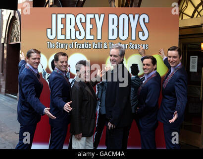 Frankie Valli (third from left) and original Four Season Bob Gaudio (trhird from right) with the cast from left: Philip Bullock who plays Nicl Massi, Glenn Carter who plays Tommy Devito, Ryan Molloy who plays Frankie and Stephen Ashfield who plays Bob Gaudio as they launch the award winning Broadway Musical 'Jersey Boys' at the Prince Edward Theatre in central London. Stock Photo