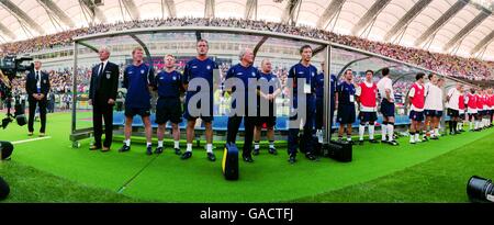 The England team line up for their National anthem prior to the game with Brazil at the Shizuoka Stadium Ecopa Stock Photo