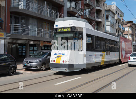 The Coastal Tram (Kusttram) and tramlines in the Belgian coastal town of  De Panne, Belgium Stock Photo