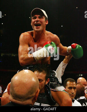 Wales' Joe Calzaghe celebrates his points victory over Denmark's Mikkel Kessler following the WBO/WBA/WBC Super-Middleweight Title bout at Millennium Stadium, Cardiff. Stock Photo