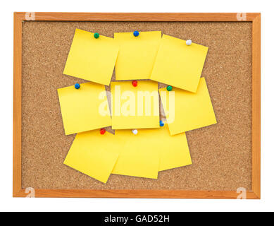 Yellow blank note on Cork board on isolated white with clipping path. Stock Photo