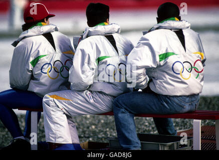 Fans watch the action wearing official Olympic coats. Stock Photo