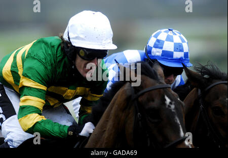 Horse Racing - Cheltenham Racecourse. Tony McCoy on Kia Kaha (left) on his way to victory in The Ryman The Stationer Novices' Handicap Hurdle Race at Cheltenham Racecourse. Stock Photo