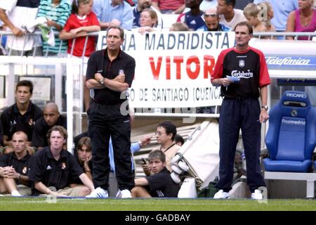 Gerard Houllier and Phil Thompson watch their Liverpool side play AC Milan with ex-player Steve McManaman watching also before his Real Madrid played Bayern Munich Stock Photo