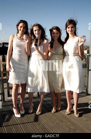 Classical girl group All Angels (left-right) Laura Wright, Charlotte Ritchie, Daisy Chute & Melanie Nakhla highlighting Universal Music Group's decision to remove copy protection across it's entire Classics & Jazz catalogue in a download trial, at Universal's head office in Kensington, west London. Stock Photo