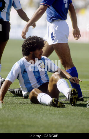 Argentina's Diego Maradona on the floor after yet another foul Stock Photo