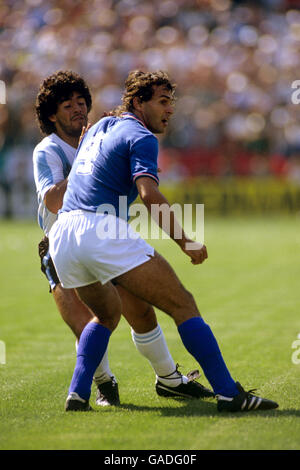 Soccer - World Cup Spain 1982 - Group C - Argentina v Italy - Estadio Sarria. Argentina's Diego Maradona (l) tries to get away from Italy's Antonio Cabrini (r) Stock Photo