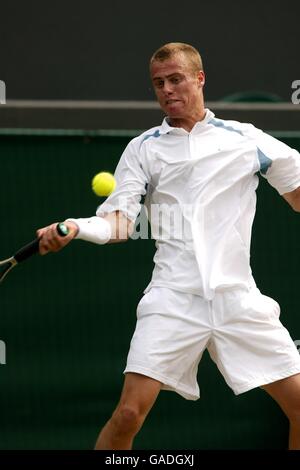 Tennis - Wimbledon 2002 - Quarter Final. Lleyton Hewitt in action against Sjeng Schalken Stock Photo