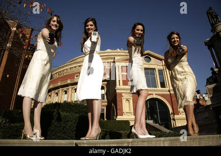 Classical girl group All Angels (left-right) Charlotte Ritchie, Melanie Nakhla, Laura Wright & Daisy Chute highlighting Universal Music Group's decision to remove copy protection across its entire Classics & Jazz catalogue in a download trial, outside the Royal Albert Hall in Kensington, west London. Stock Photo