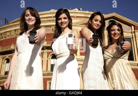 Classical girl group All Angels (left-right) Laura Wright, Charlotte Ritchie, Daisy Chute & Melanie Nakhla highlighting Universal Music Group's decision to remove copy protection across it's entire Classics & Jazz catalogue in a download trial, at Universal's head office in Kensington, west London. Stock Photo