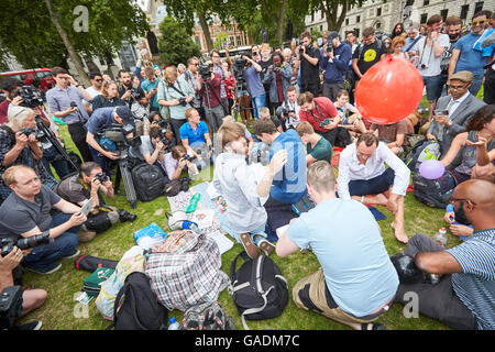 Protesters stage a mass inhalation of nitrous oxide in Parliament Square in protest against the banning of the legal high Stock Photo