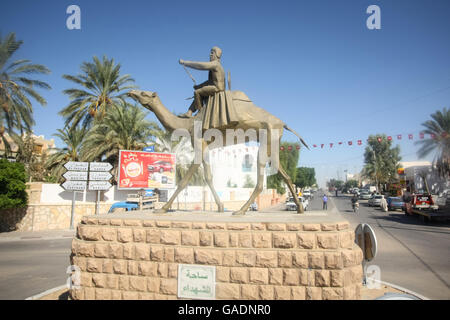 A view of a racing came statue in the town of Douz, Tunisia. The city of Douz is famous for the camel racing. Stock Photo