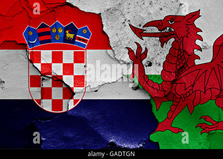 flags of Croatia and Wales painted on cracked wall Stock Photo