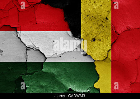 flags of Hungary and Belgium painted on cracked wall Stock Photo