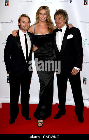 (From left to right) Ronan Keating, Penny Lancaster and Rod Stewart arrive for the Emeralds and Ivy Ball at Old Billingsgate, London. Stock Photo