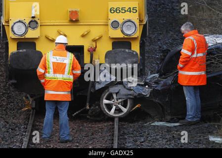Car hit by freight train Stock Photo