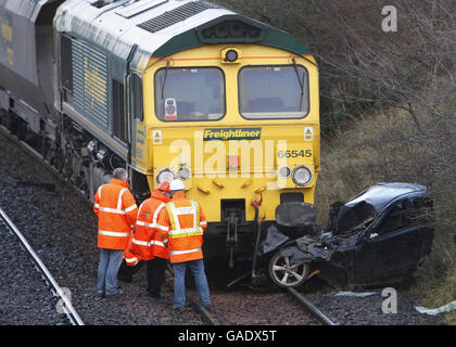 Car hit by freight train Stock Photo