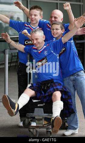 SOCCER Rangers. Glasgow Rangers fans gather at Glasgow Airport to set off for the Barcelona v Rangers Champions League game in Barcelona. Stock Photo