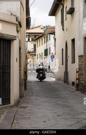 Scooter on a narrow street in Settignano, on the outskirts of Florence, Tuscany, Italy Stock Photo