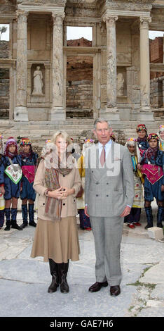 The Prince of Wales and the Duchess of Cornwall, joined by Turkish dancers, visit the ruined library of Celsus in Ephesus, Turkey. Stock Photo