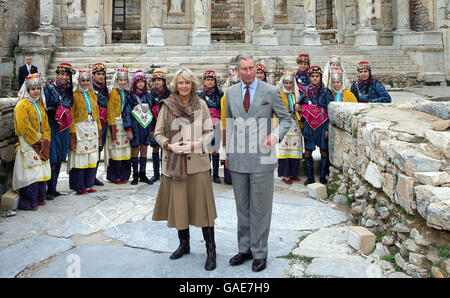 The Prince of Wales and the Duchess of Cornwall, pictured with Turkish dancers, visit the ruined library of Celsus in Ephesus, Turkey. Stock Photo