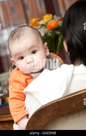 Baby, 5 months, held by mother Stock Photo