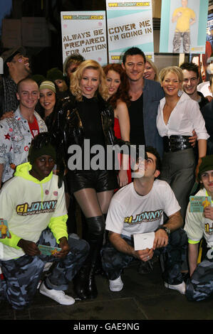 Denise Van Outen joins her fellow cast members from the musical Rent, outside the Duke of York's Theatre in central London, in a bid to combat ignorance surrounding HIV and Aids by sending out a message for World Aids Day, tomorrow. Stock Photo