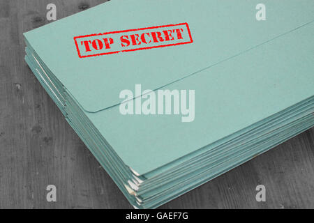 Folders files with top secret stamped in red Stock Photo