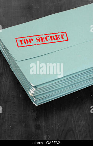 Folders files with top secret stamped in red Stock Photo - Alamy
