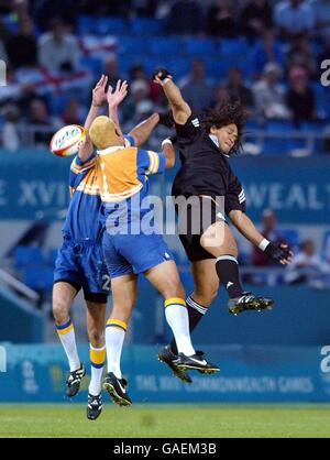 Commonwealth Games - Manchester 2002 - Rugby 7's - New Zealand v Niue Islands. New Zealand's Brett Kamutoa jumps with Niue Islands Chad Bronson T Atapana Siakimotu and Hayden Head for a high ball Stock Photo