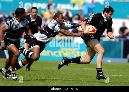 Fiji's Norman Ligairi holds onto New Zealand's Craig De Goldi Stock Photo