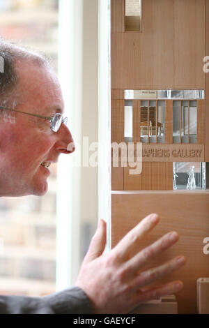 Architect John Tuomey of O'Donnell & Tuomey with a model of the new Photographers Gallery, due to be built in Soho, London. Stock Photo