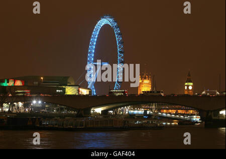 A view by night of Waterloo Bridge crossing the River Thames with a ...