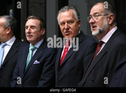 The Work and Pensions Secretary Peter Hain celebrates with workers, some of whom used to be employed by steel company ASW in Cardiff and Sheerness in Kent, as news of a 2.9 billion rescue package to restore the pensions of up to 140,000 workers was announced by the Government today at Caxton House in Central London. Stock Photo