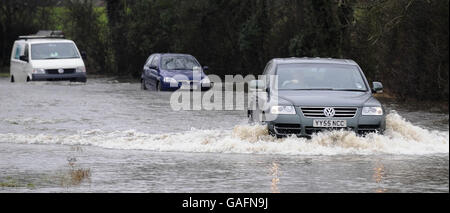 Vehicles face flooded roads with rising floodwater near Naburn close to York today as River levels in the area continue to rise following heavy rainfall. Stock Photo