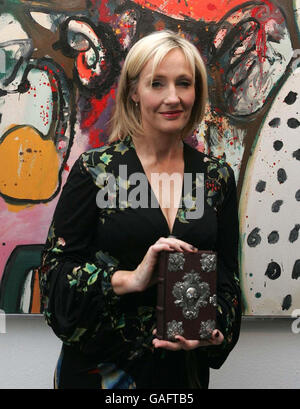 JK Rowling pictured with her book 'The Tales of Beedle the Bard' which is to be auctioned in Sotheby's on Thursday 13 December to raise funds for the Childrens Voice campaign, London. Stock Photo