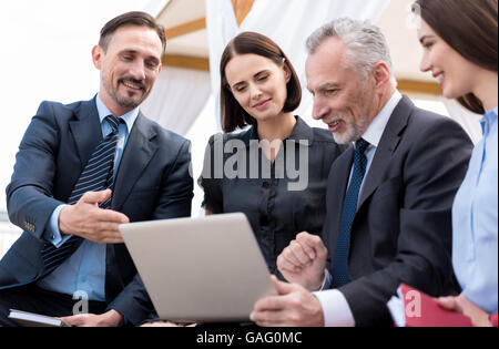 Positive professional colleagues working on the project Stock Photo