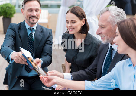 Positive smiling colleagues working on the project Stock Photo