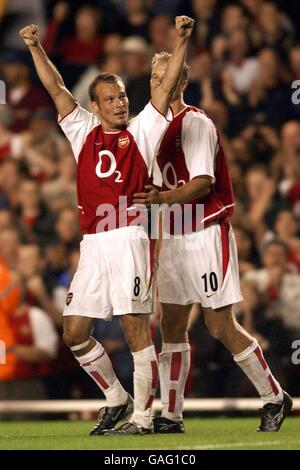 Fredrik Ljungberg of Arsenal celebrates after scoring the second goal with Dennis Bergkamp who scored the first goal during the 2-0 victory Stock Photo