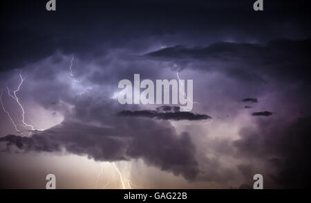 Cloudscape with lightning bolt hitting among the clouds Stock Photo