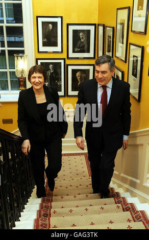 Britain's Prime Minister Gordon Brown talks with the Prime Minister of New Zealand, Helen Clark, as they walk up the steps of 10 Downing street, London for a meeting this morning. Stock Photo