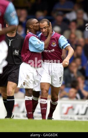 West Ham United's Jermain Defoe (l) congratulates teammate Paolo Di Canio (r) on scoring the second goal Stock Photo