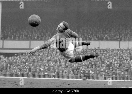 Manchester United goalkeeper Harry Gregg pushes a shot safely outside the post, during the FA Cup semi-final match at Villa Park. Result was 2-2 draw, teams will meet again at Highbury. Stock Photo