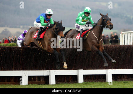 Vodka Bleu ridden by Timmy Murphy (left) jumps the last with Patman du Charmill ridden by P.J.Brennan to go on and win the TurfTV New Year Steeple Chase at Cheltenham Racecourse. Stock Photo
