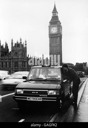 The stylish new Metrocab taxi picks up a fare on London's Westminster bridge. The five passenger city cab was unveiled at Wembley Conference Centre, a challenger to the monopoly of the traditional black cab. The purpose-built estate is the work of Birmingham manufacturers Metro-Cammell Weymann and has the needs of disabled passengers incorporated into the design. Stock Photo