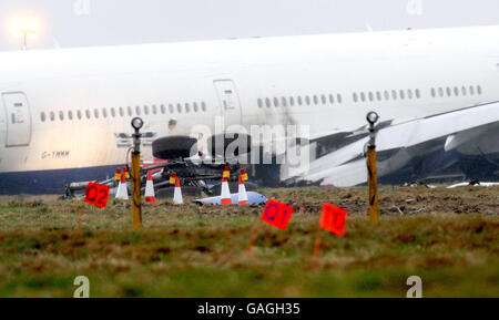 A British Airways Boeing 777 plane lies at the foot of the Southern runway after its crash landing at Heathrow airport yesterday. Stock Photo