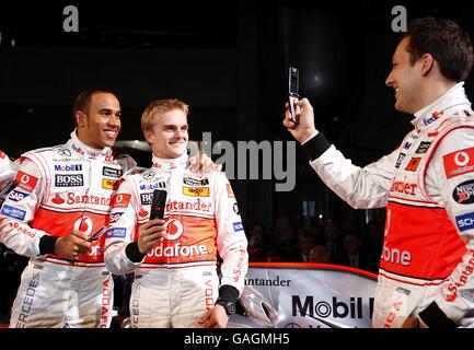 Vodafone McLaren Mercedes drivers, from left, Lewis Hamilton Heikki Kovalainen and Gary Paffet during the launch of the Vodafone McLaren Mercedes MP4-23 at the Mercedes-Benz Museum, Stuttgart. Stock Photo