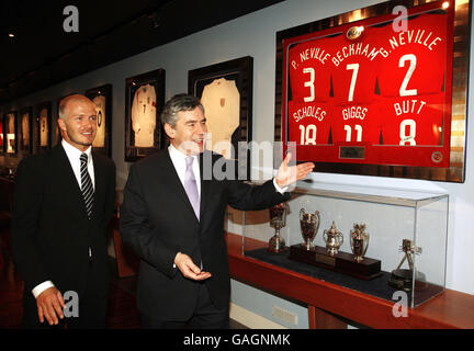 Britain's Prime Minister Gordon Brown chats with David Beckham during a visit to The David Beckham Academy in London. Stock Photo