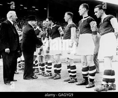 Soccer - Football League Wartime Cup - Final - West Ham United v Blackburn Rovers - Wembley - 1940. Mr Albert Victor Alexander (second l), First Lord of the Admiralty, shakes hands with the West Ham United players before the match. Stock Photo